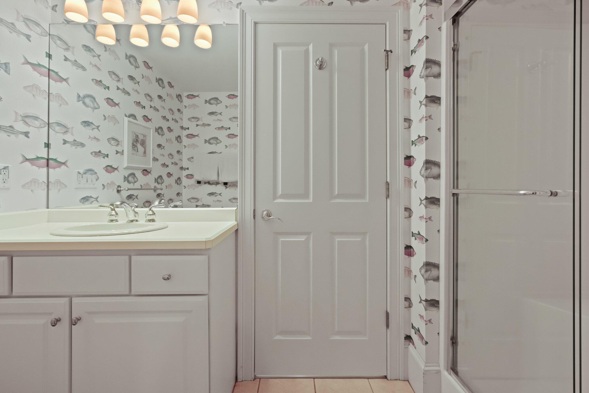 99 Center Lane Centerville, MA 02632 - Photo 46 of 89 a bathroom with a sink a mirror and shower