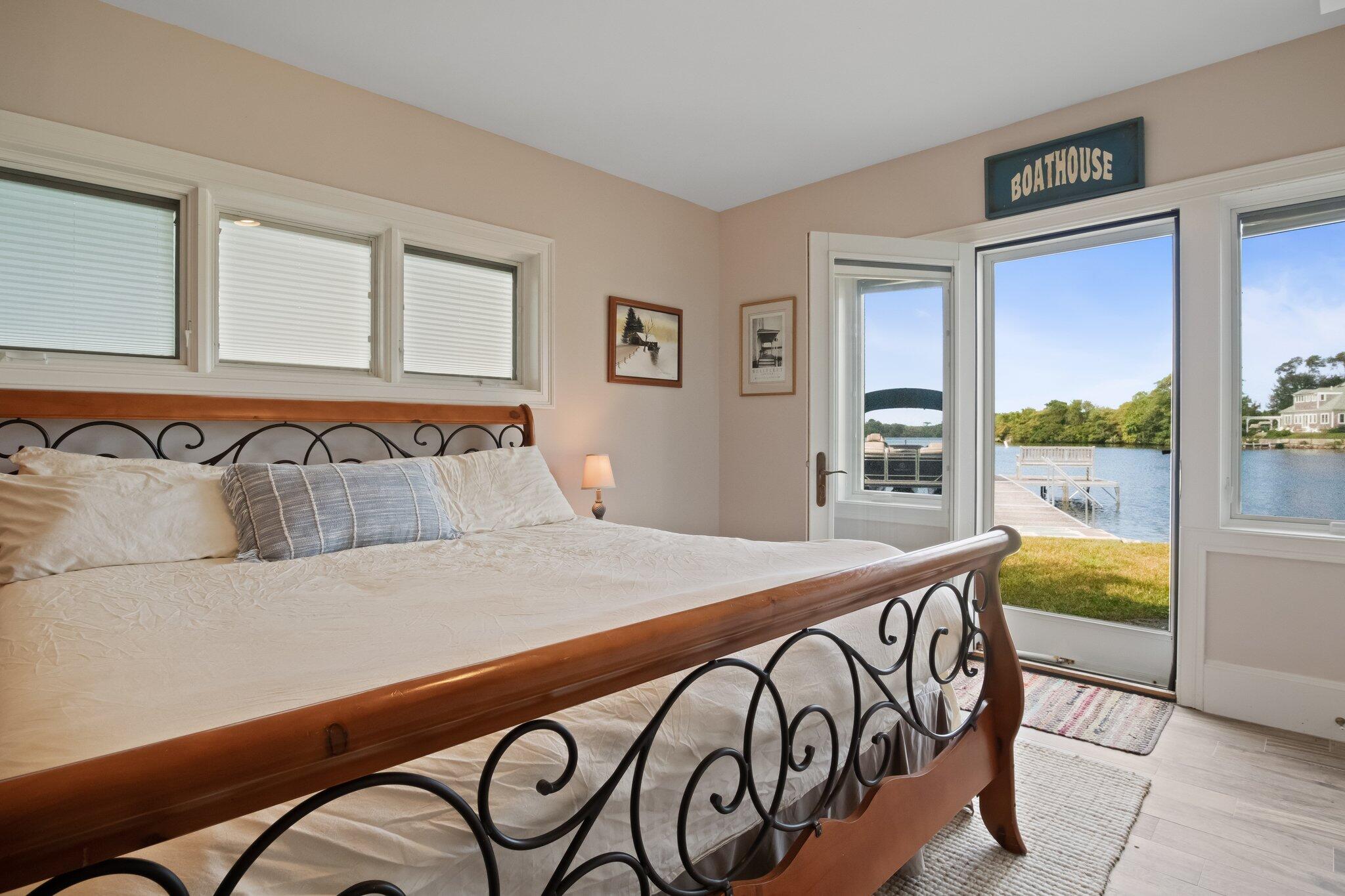 99 Center Lane Centerville, MA 02632 - Photo 51 of 89 a bedroom with a bed and a table in it