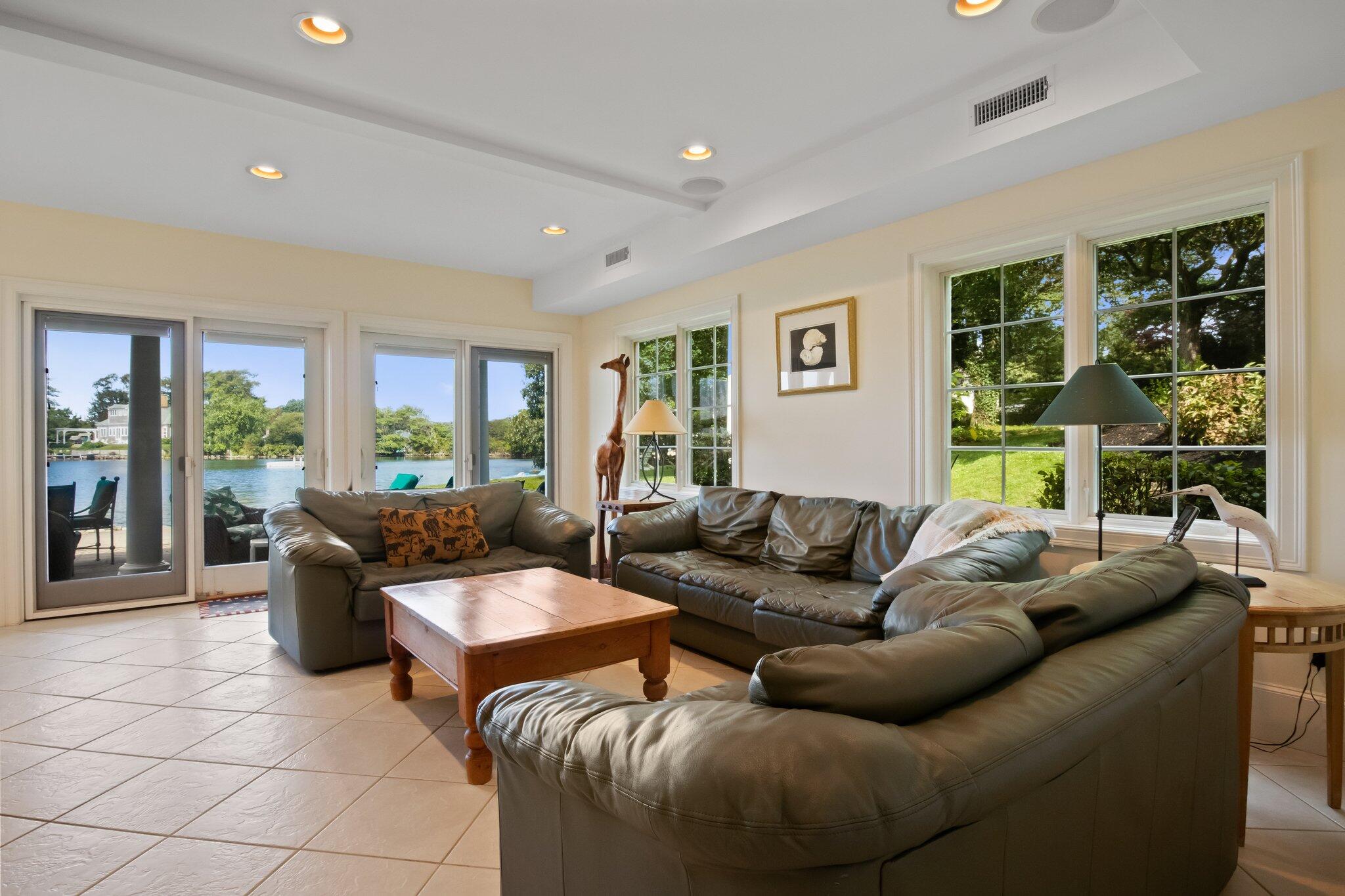99 Center Lane Centerville, MA 02632 - Photo 53 of 89 a living room with furniture and a large window