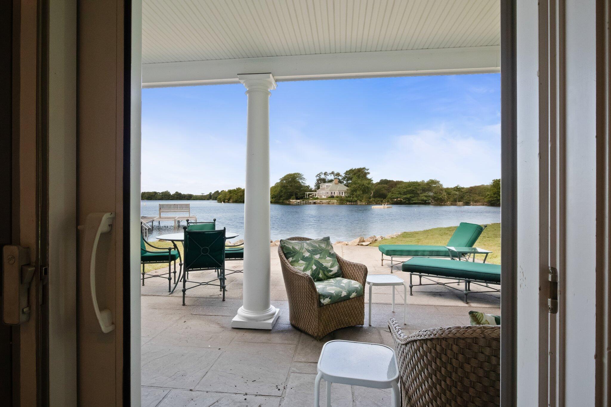 99 Center Lane Centerville, MA 02632 - Photo 55 of 89 a balcony with furniture and a floor to ceiling window