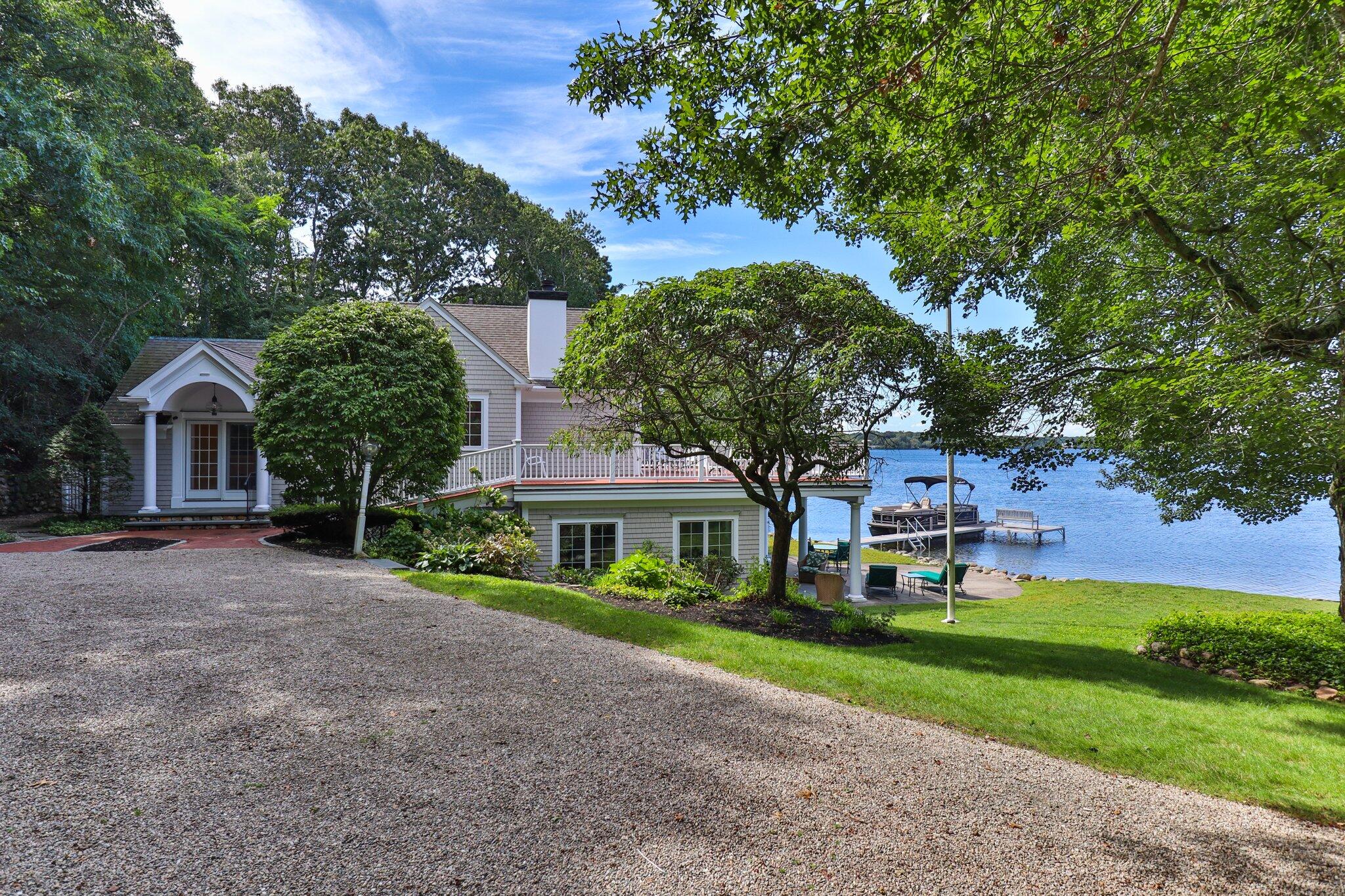 99 Center Lane Centerville, MA 02632 - Photo 6 of 89 a front view of a house with garden