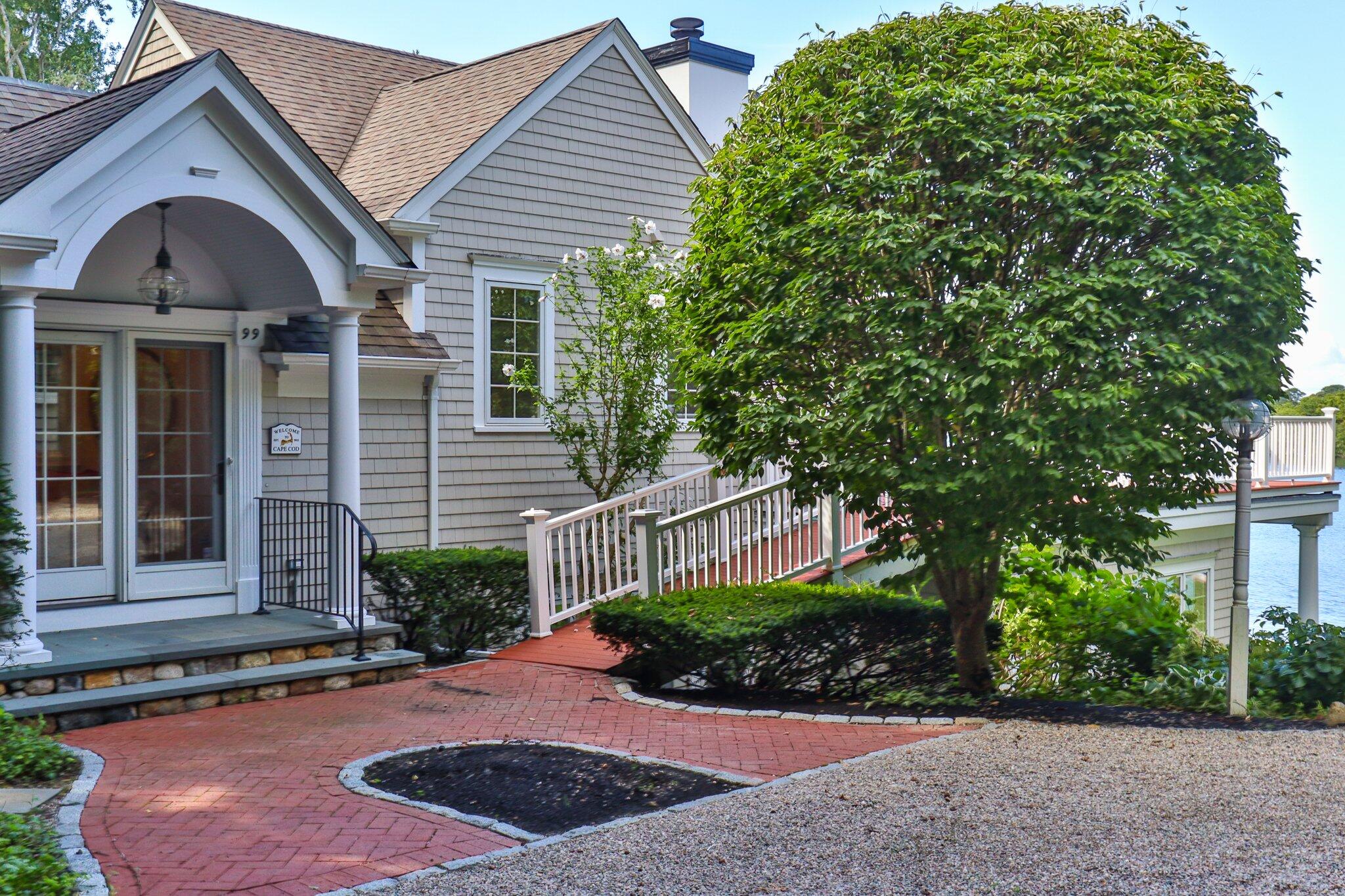 99 Center Lane Centerville, MA 02632 - Photo 71 of 89 a front view of a house with a yard