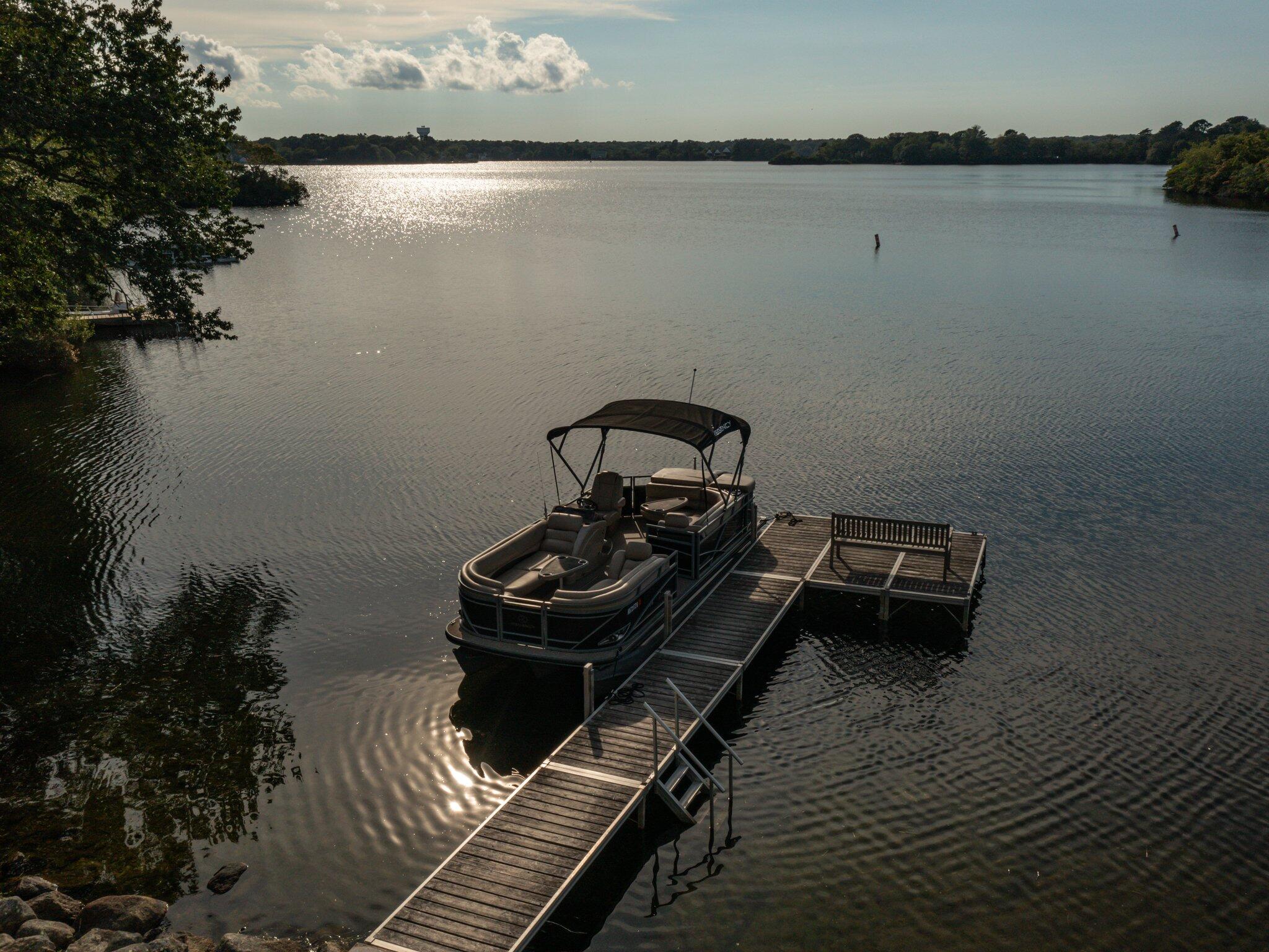 99 Center Lane Centerville, MA 02632 - Photo 83 of 89 a bed sitting on top of a wooden floor