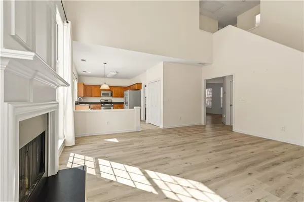 a view of a kitchen with furniture and a fireplace