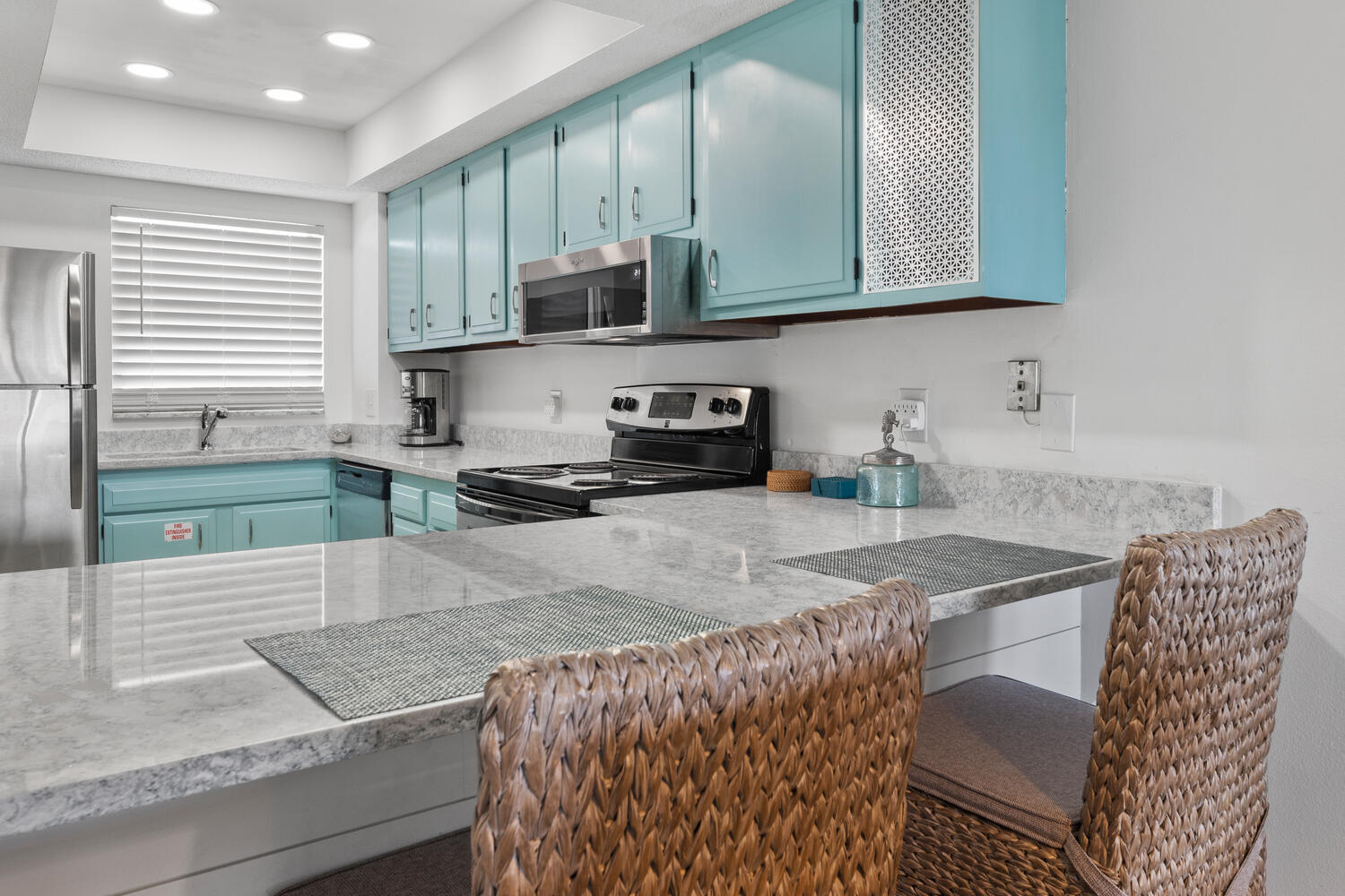 909 Santa Rosa Boulevard, Unit 256 Fort Walton Beach, FL 32548 - Photo 3 of 33 a kitchen with stainless steel appliances granite countertop a stove a sink and a microwave