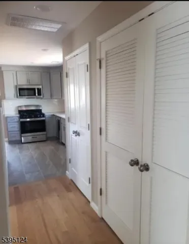 a view of a kitchen from the hallway