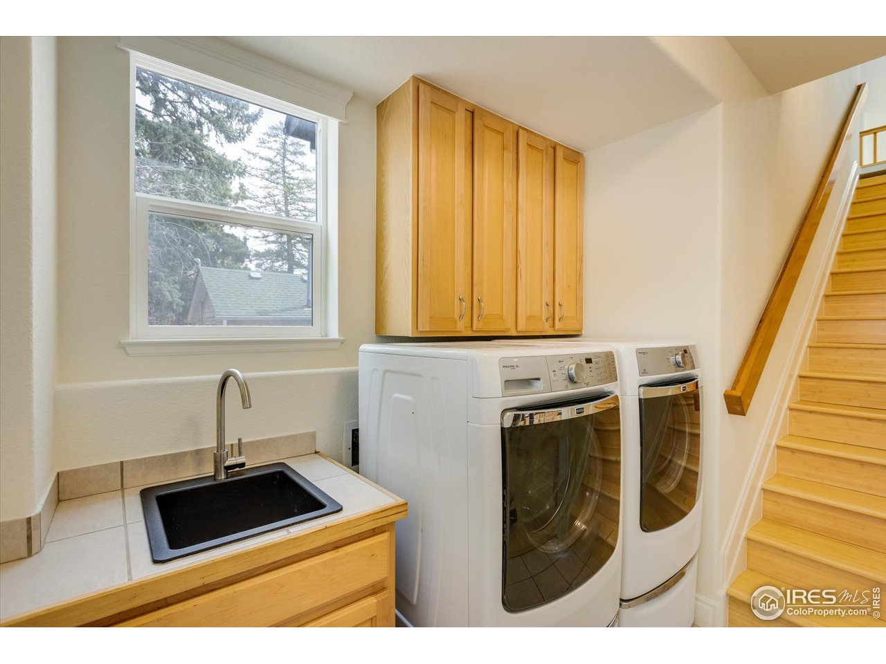 1241 High Street Boulder, CO 80304 - Photo 13 of 36 a bathroom with a sink a mirror and a window