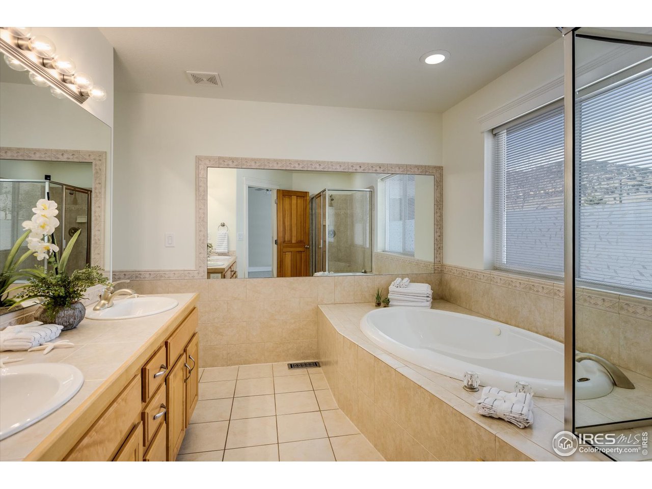 1241 High Street Boulder, CO 80304 - Photo 18 of 36 a bathroom with a sink and a mirror