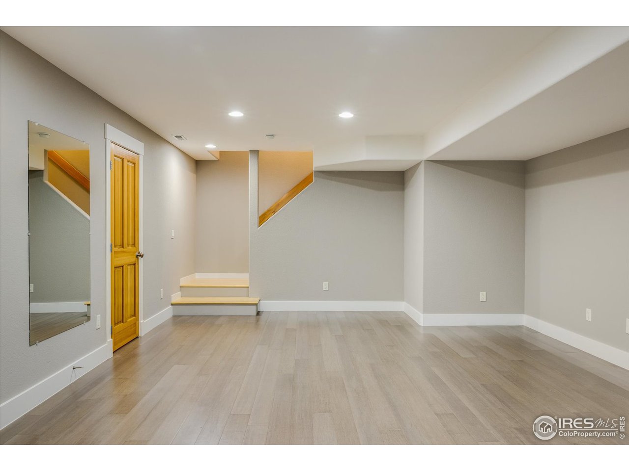 1241 High Street Boulder, CO 80304 - Photo 22 of 36 a view of an empty room with wooden floor