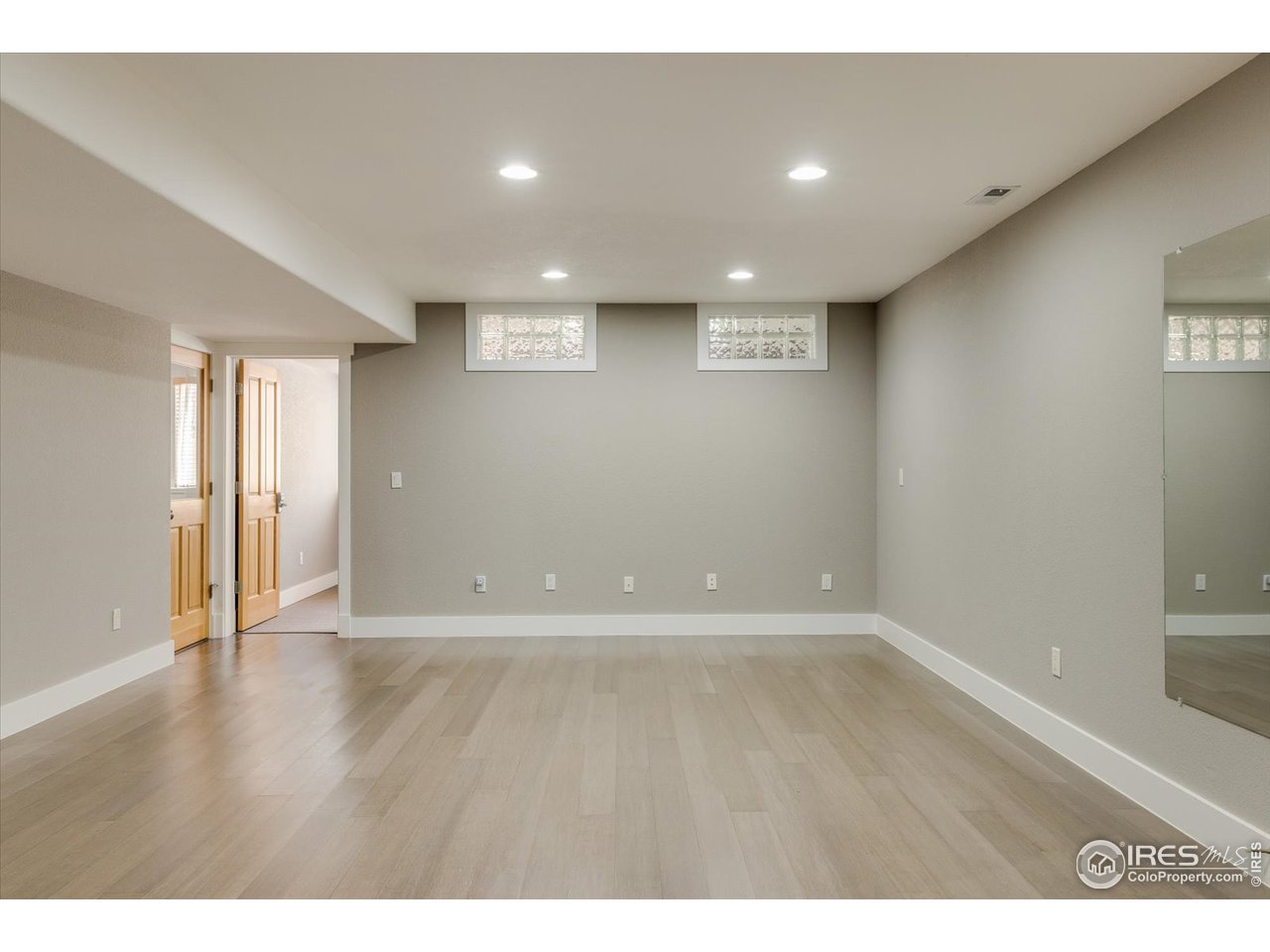 1241 High Street Boulder, CO 80304 - Photo 23 of 36 a view of an empty room with wooden floor