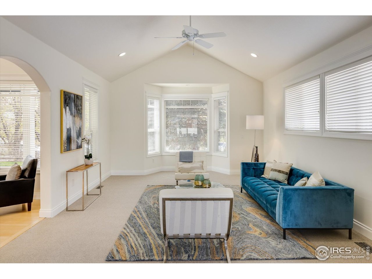 1241 High Street Boulder, CO 80304 - Photo 3 of 36 a living room with furniture and a large window