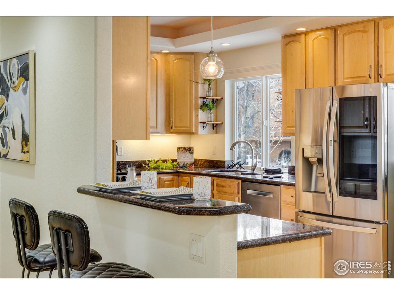1241 High Street Boulder, CO 80304 - Photo 6 of 36 a kitchen with stainless steel appliances granite countertop a sink and cabinets