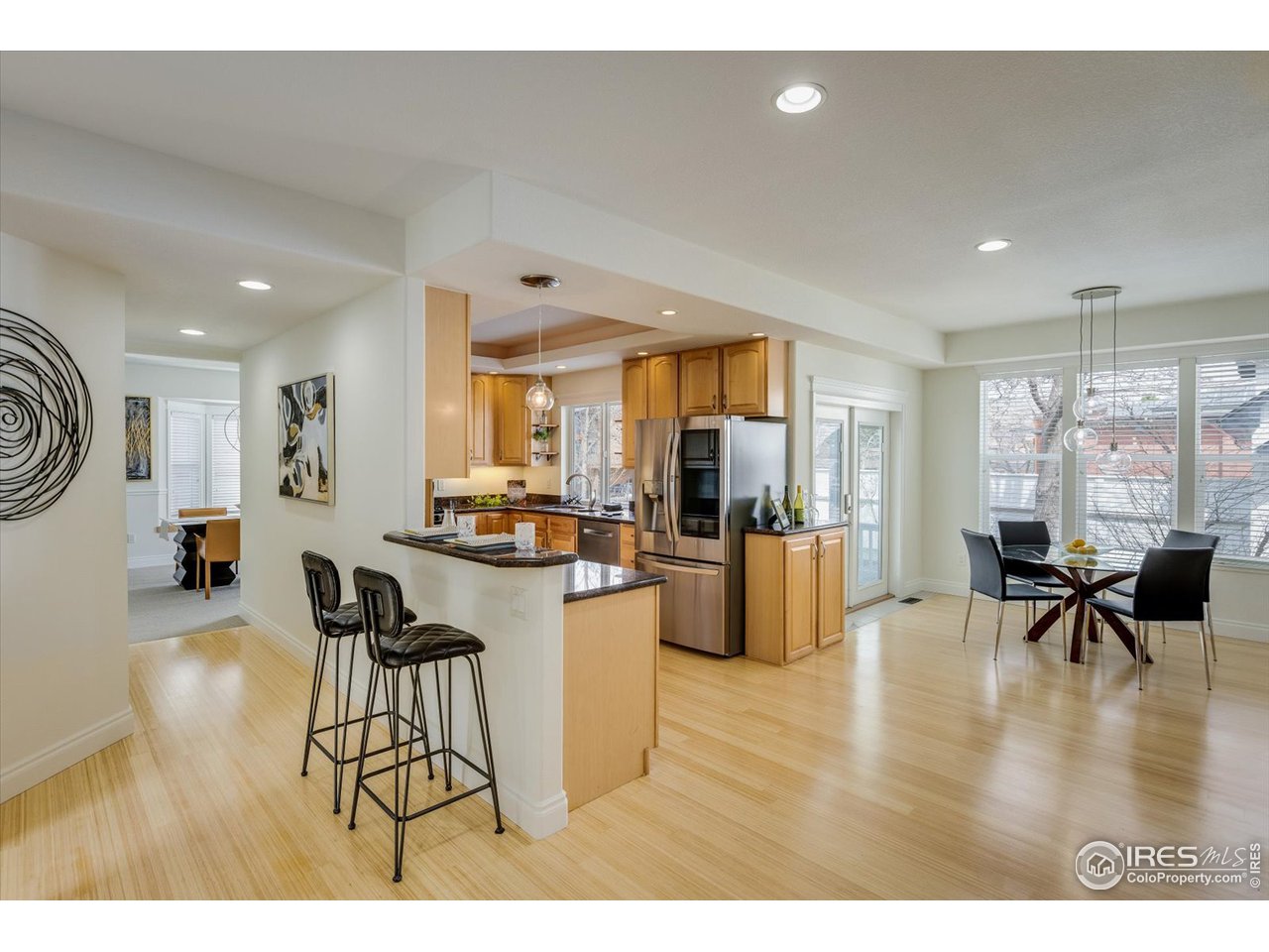 1241 High Street Boulder, CO 80304 - Photo 7 of 36 a living room with furniture a dining table and chairs