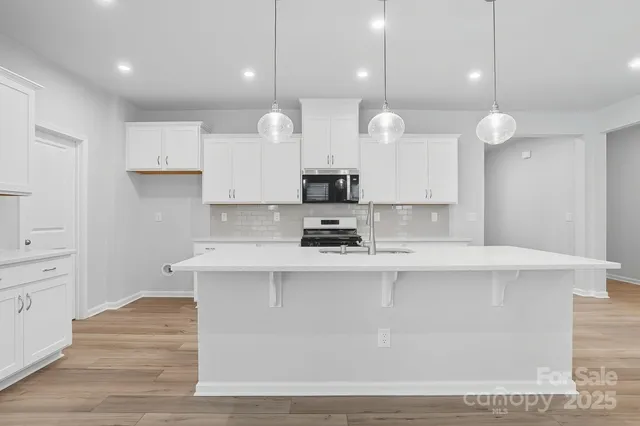 a large kitchen with a large island in it