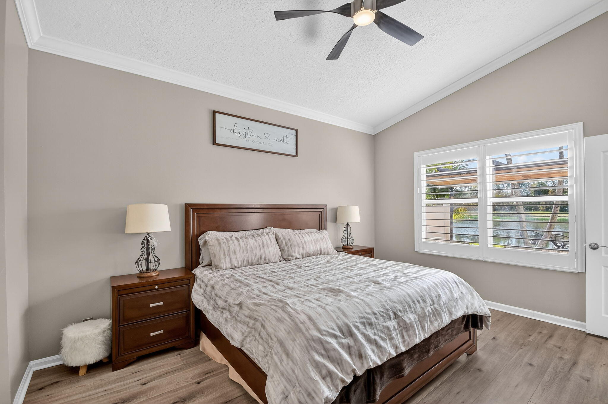 10202 Clubhouse Turn Road Lake Worth, FL 33449 - Photo 11 of 21 a bedroom with a bed and wooden floor