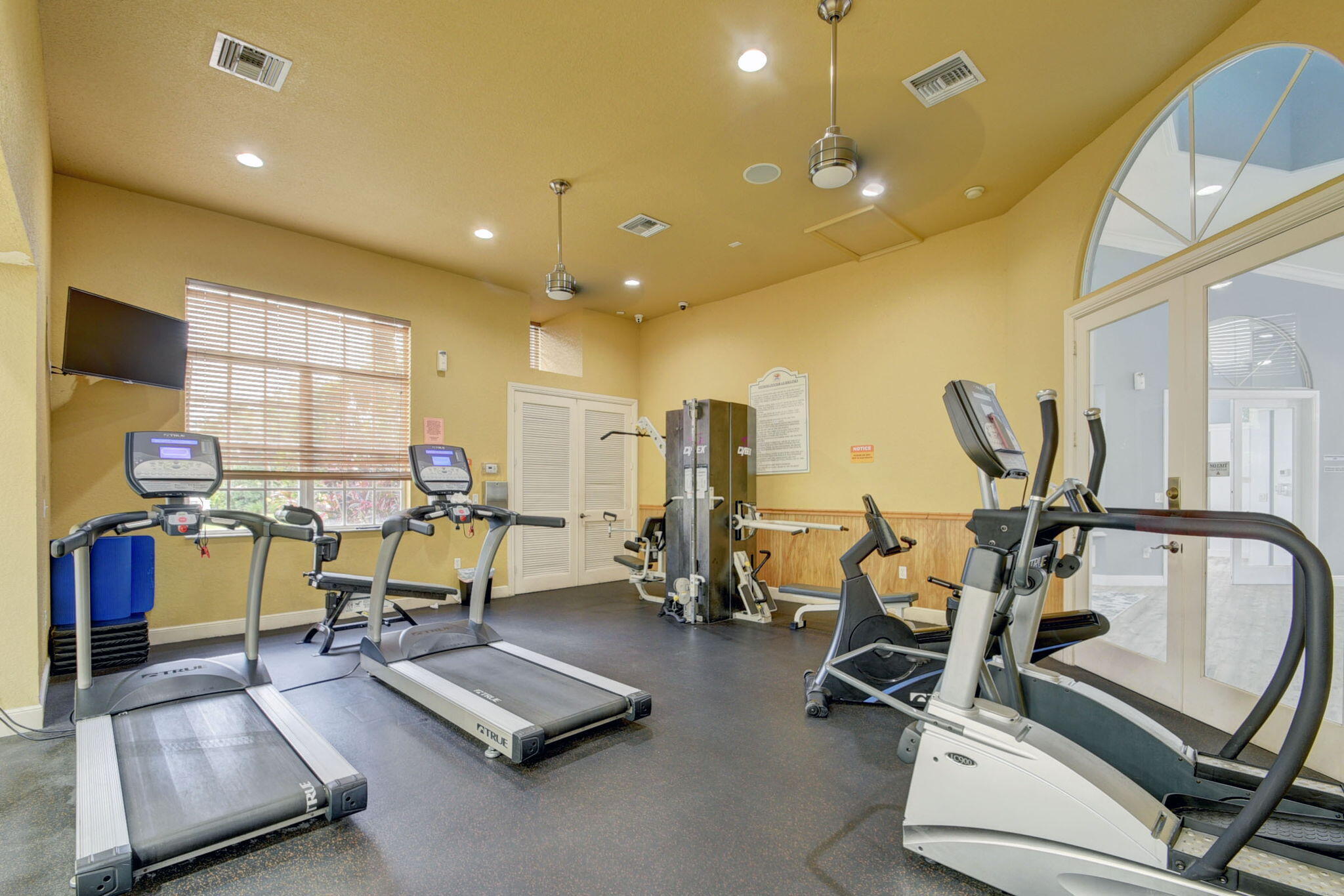 10202 Clubhouse Turn Road Lake Worth, FL 33449 - Photo 14 of 21 a view of a room with gym equipment