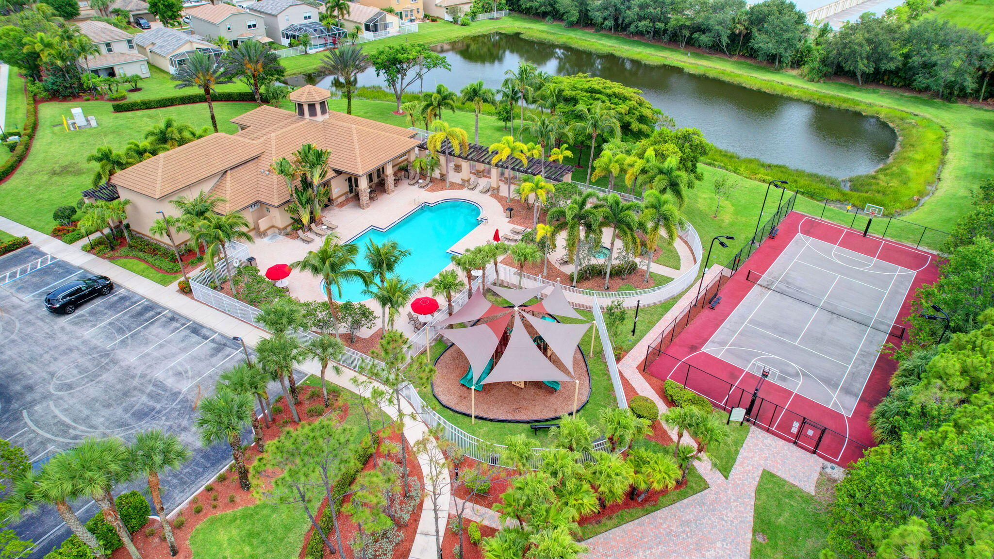 10202 Clubhouse Turn Road Lake Worth, FL 33449 - Photo 20 of 21 an aerial view of a swimming pool with a yard and outdoor seating