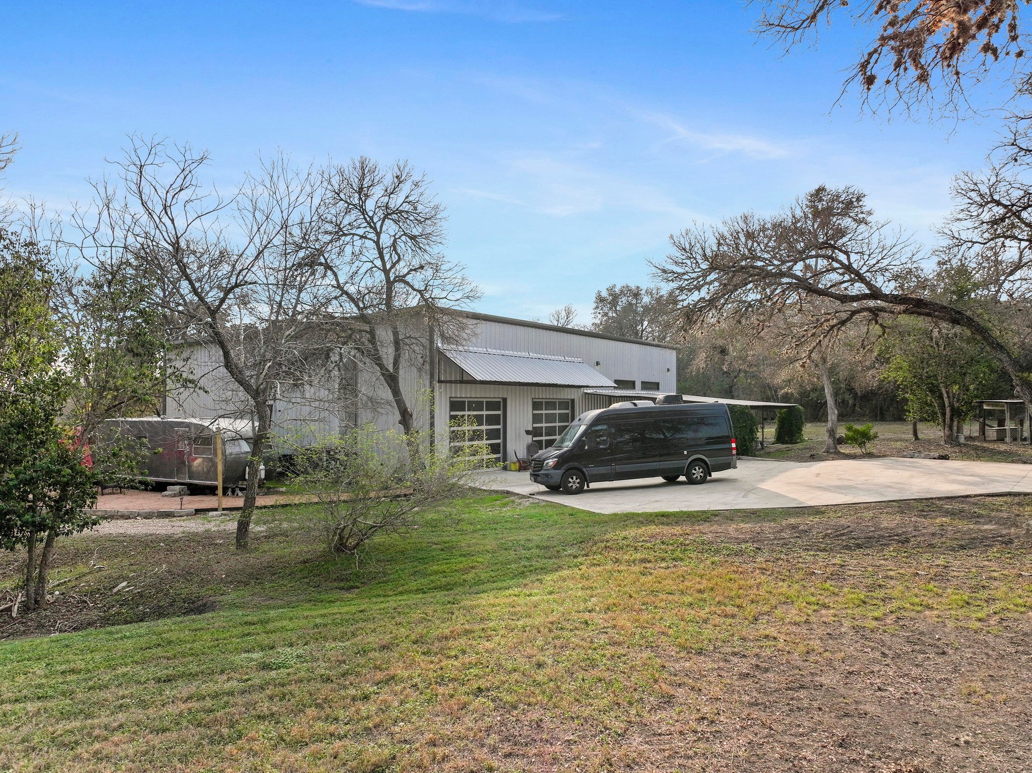 12302 Bethel Church Road Manchaca, TX 78652 - Photo 28 of 35 View of home's exterior featuring a yard