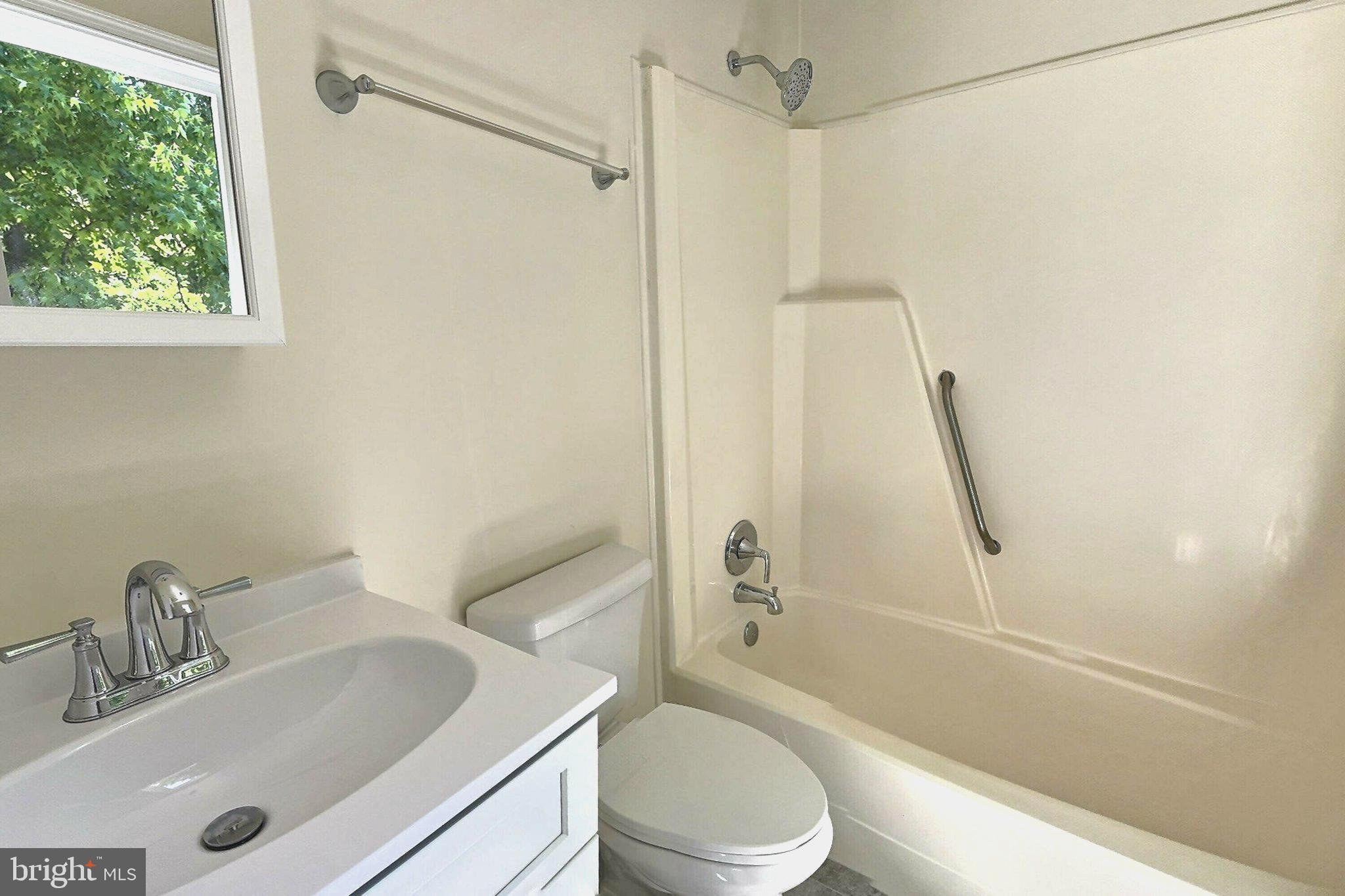 2001 Powder Horn Drive Fort Washington, MD 20744 - Photo 18 of 26 a bathroom with a sink a toilet and shower