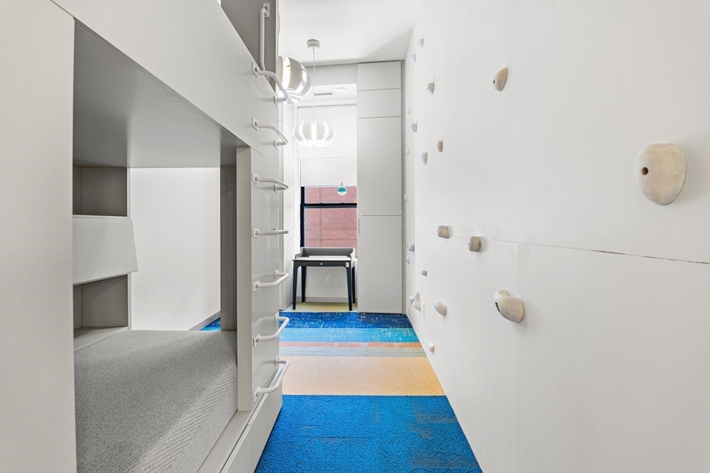 453 Washington Street, Unit 3A Boston, MA 02111 - Photo 15 of 18 a hallway with wooden floor