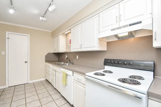 a kitchen with a stove and a sink