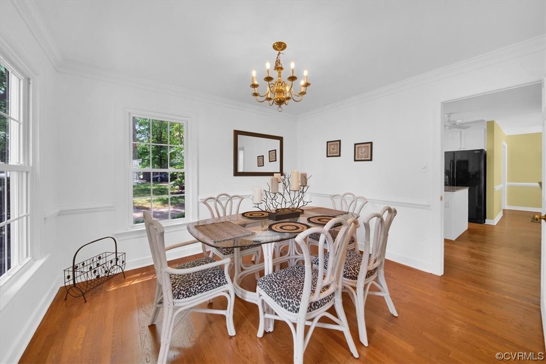 12516 Eagle Ridge Road Henrico, VA 23233 - Photo 11 of 48 Wood floored dining area featuring a notable chandelier and natural light