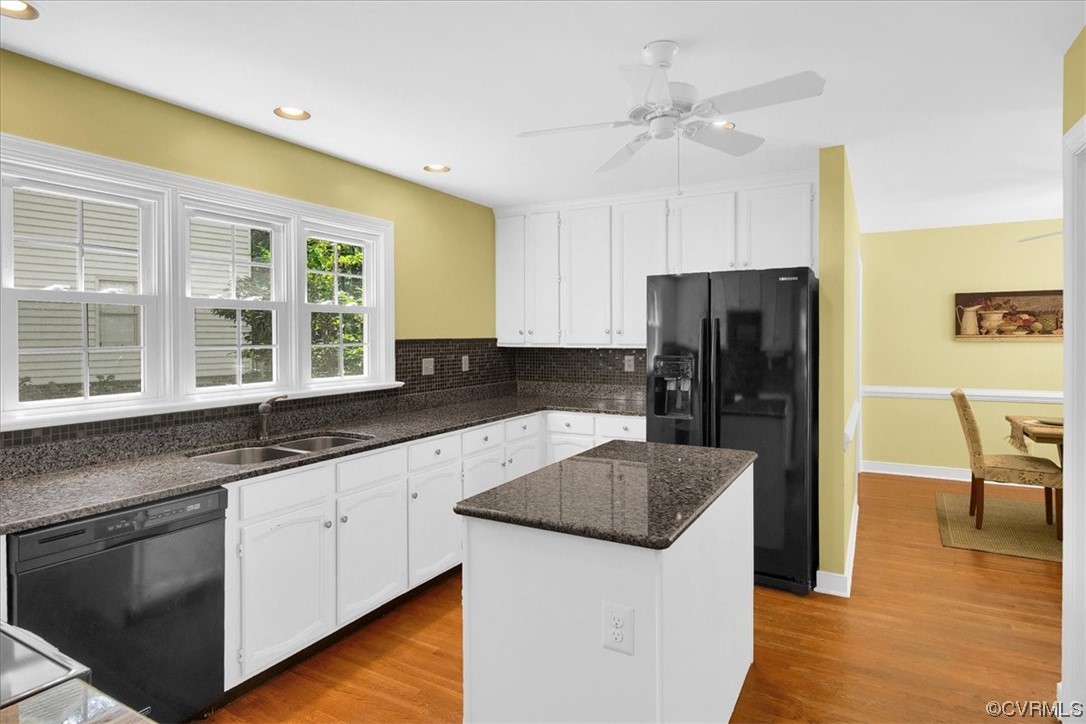 12516 Eagle Ridge Road Henrico, VA 23233 - Photo 13 of 48 Kitchen with a center island, a ceiling fan, natural light, refrigerator, dishwasher, light parquet floors, white cabinets, and dark countertops