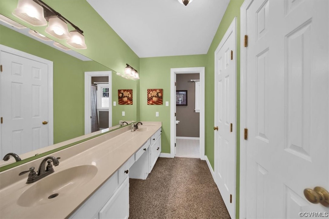 12516 Eagle Ridge Road Henrico, VA 23233 - Photo 31 of 48 Primary Bathroom featuring double large vanity, 2 walk in closets, and linen closet