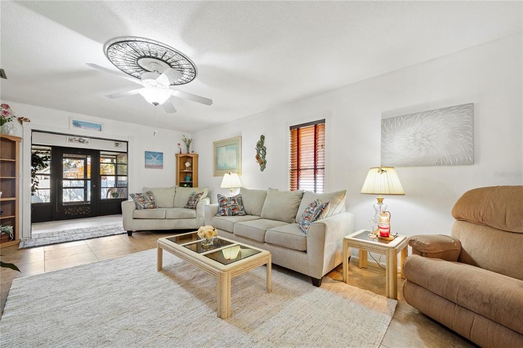 7360 Ulmerton Road, Unit 15D Largo, FL 33771 - Photo 17 of 75 a living room with furniture and a large window