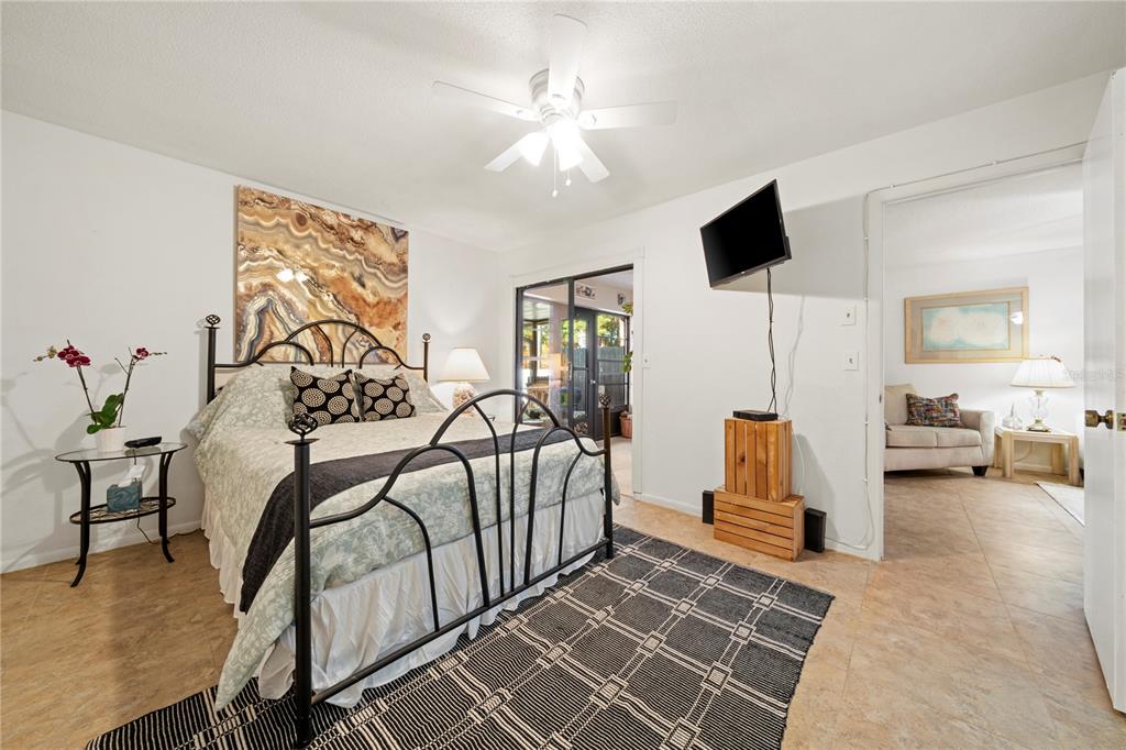 7360 Ulmerton Road, Unit 15D Largo, FL 33771 - Photo 24 of 75 a view of a livingroom with furniture and a flat screen tv