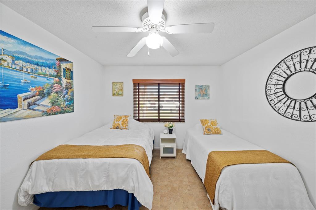 7360 Ulmerton Road, Unit 15D Largo, FL 33771 - Photo 28 of 75 a bedroom with a bed and a window