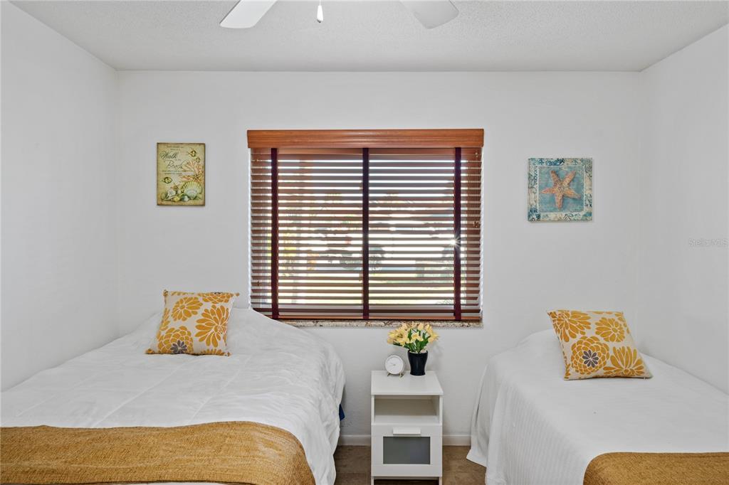 7360 Ulmerton Road, Unit 15D Largo, FL 33771 - Photo 30 of 75 a bedroom with a bed and a window