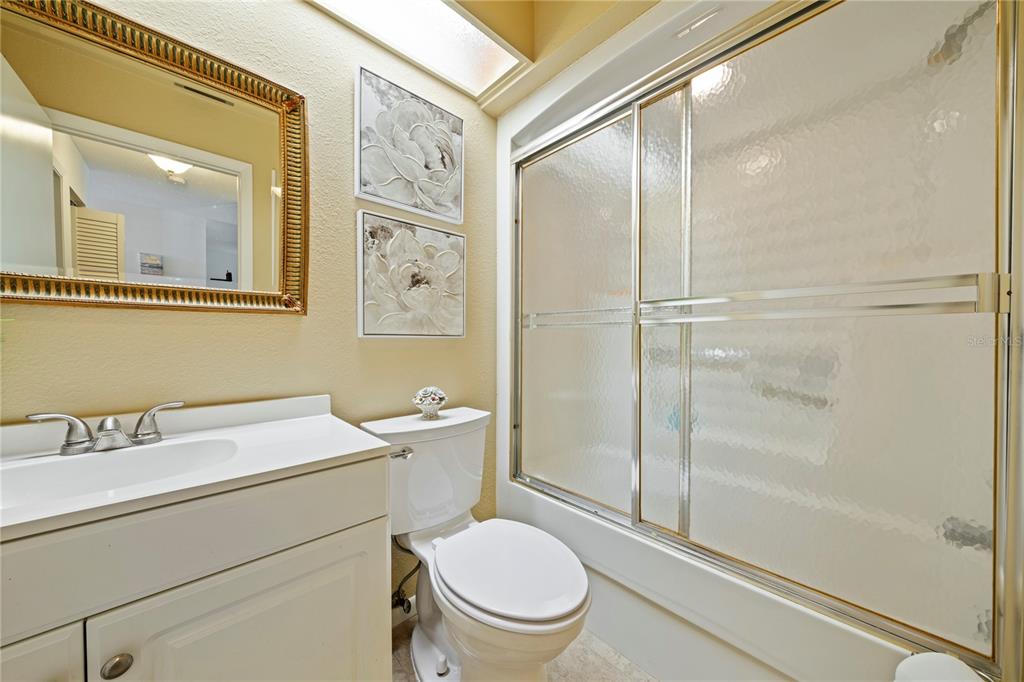 7360 Ulmerton Road, Unit 15D Largo, FL 33771 - Photo 34 of 75 a bathroom with a toilet a sink and a shower