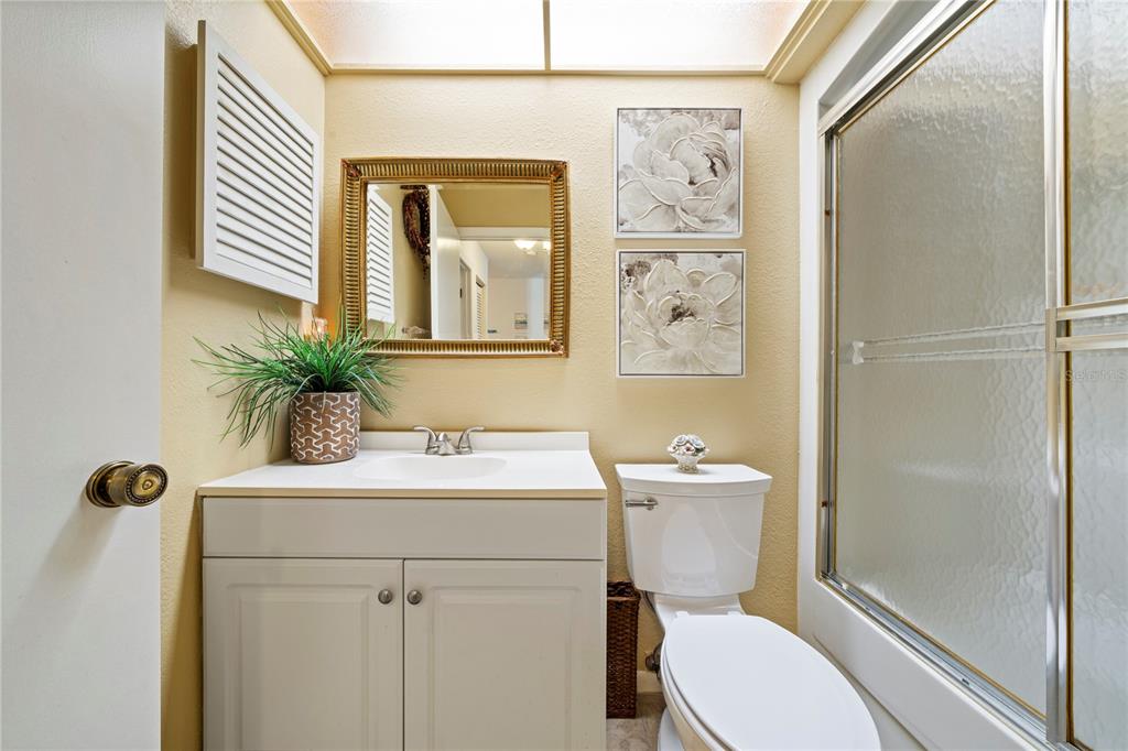 7360 Ulmerton Road, Unit 15D Largo, FL 33771 - Photo 35 of 75 a bathroom with a sink a toilet and shower