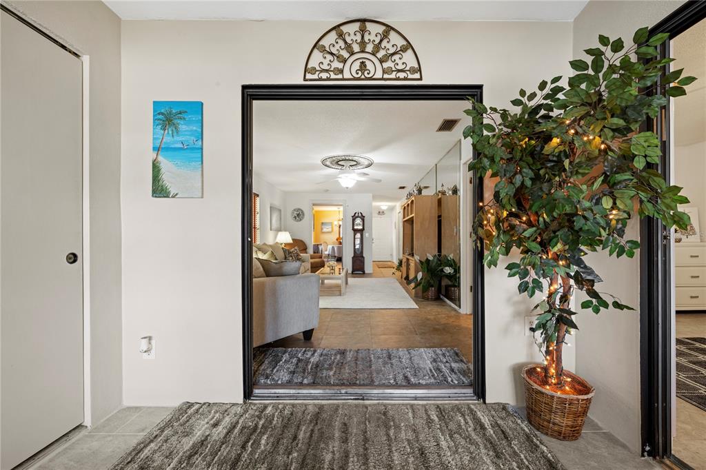 7360 Ulmerton Road, Unit 15D Largo, FL 33771 - Photo 36 of 75 a living room with furniture and a potted plant