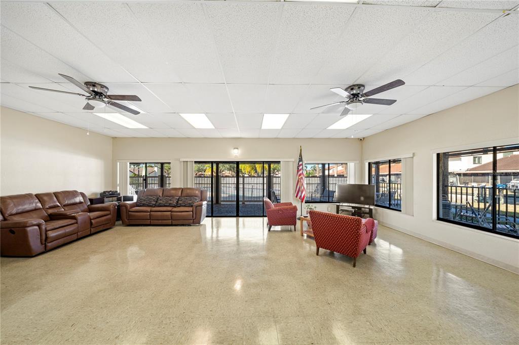 7360 Ulmerton Road, Unit 15D Largo, FL 33771 - Photo 47 of 75 a living room with furniture and a flat screen tv