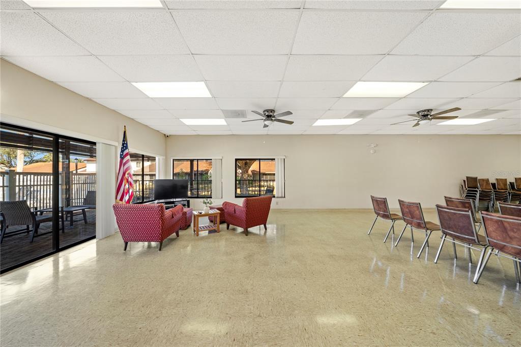 7360 Ulmerton Road, Unit 15D Largo, FL 33771 - Photo 49 of 75 a living room with furniture and chandelier