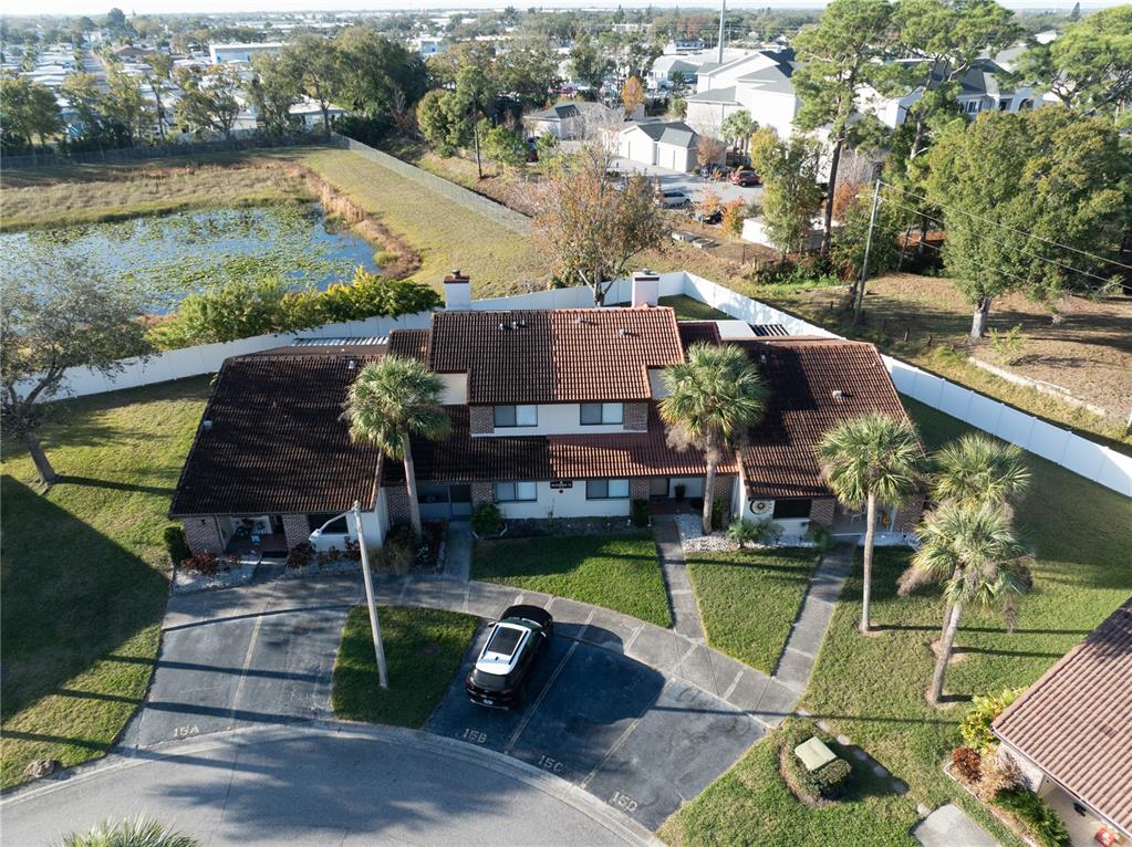 7360 Ulmerton Road, Unit 15D Largo, FL 33771 - Photo 54 of 75 an aerial view of a house with swimming pool and outdoor seating