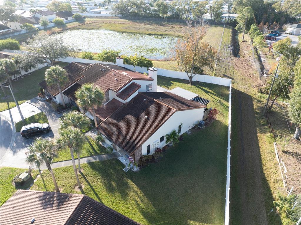 7360 Ulmerton Road, Unit 15D Largo, FL 33771 - Photo 55 of 75 a view of a lake with couches in front of house