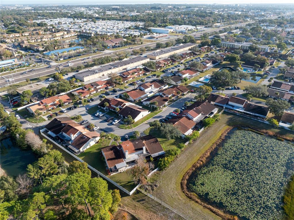 7360 Ulmerton Road, Unit 15D Largo, FL 33771 - Photo 59 of 75 an aerial view of residential houses with outdoor space