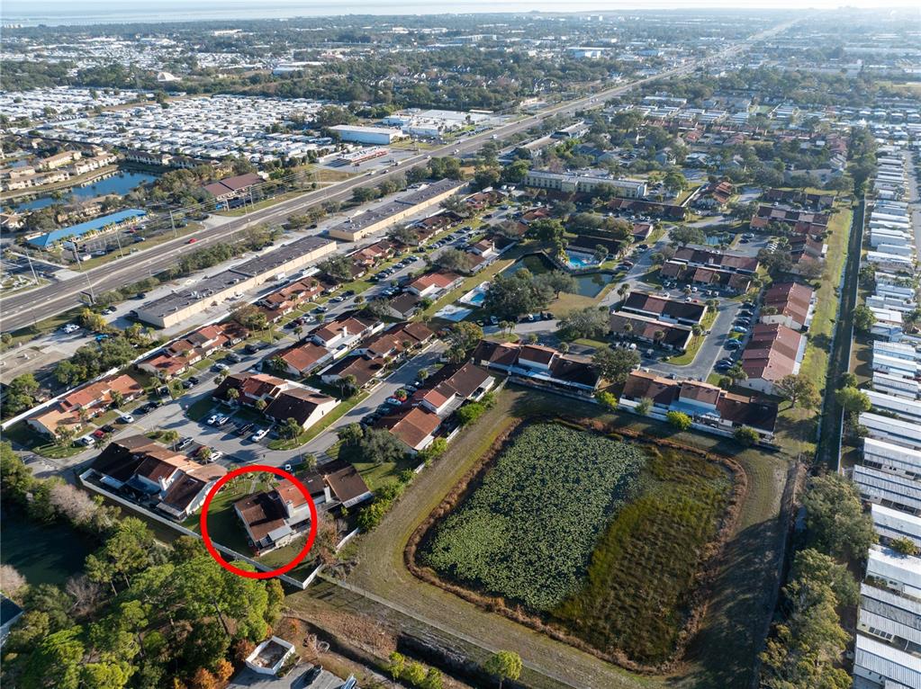 7360 Ulmerton Road, Unit 15D Largo, FL 33771 - Photo 60 of 75 an aerial view of residential houses with city view
