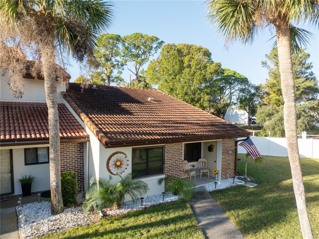 7360 Ulmerton Road, Unit 15D Largo, FL 33771 - Photo 75 of 75 a front view of a house with garden