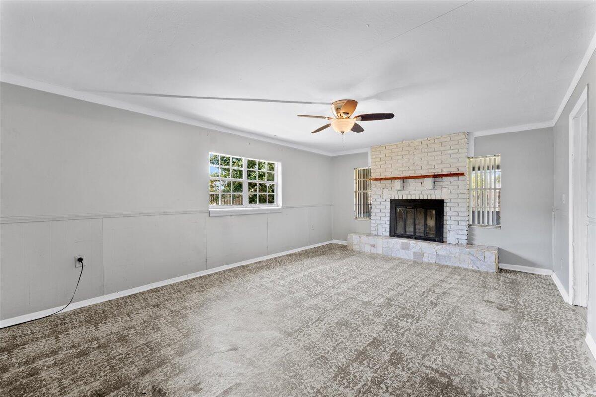 3308 Purdue Street Melbourne, FL 32901 - Photo 13 of 43 an empty room with windows and fireplace