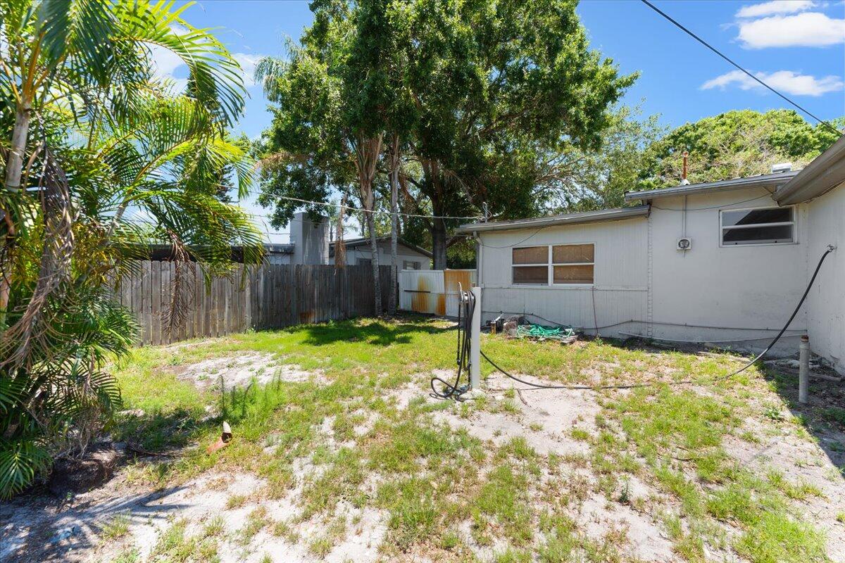 3308 Purdue Street Melbourne, FL 32901 - Photo 29 of 43 a backyard of a house with a yard and outdoor seating