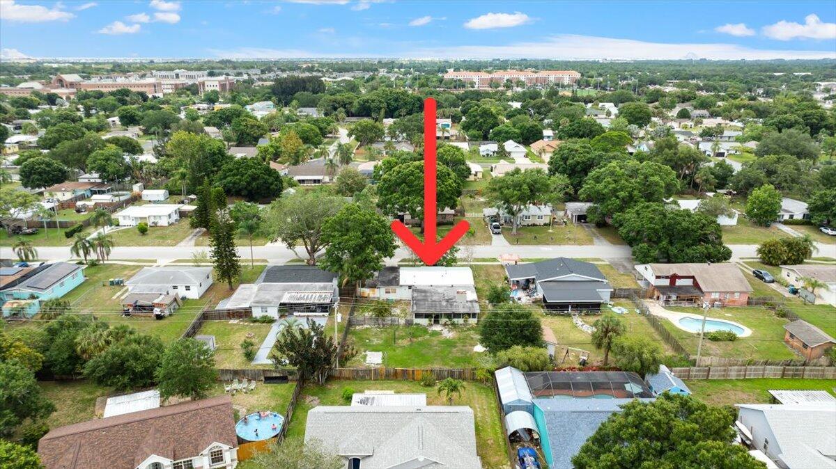 3308 Purdue Street Melbourne, FL 32901 - Photo 37 of 43 an aerial view of residential houses with outdoor space and swimming pool