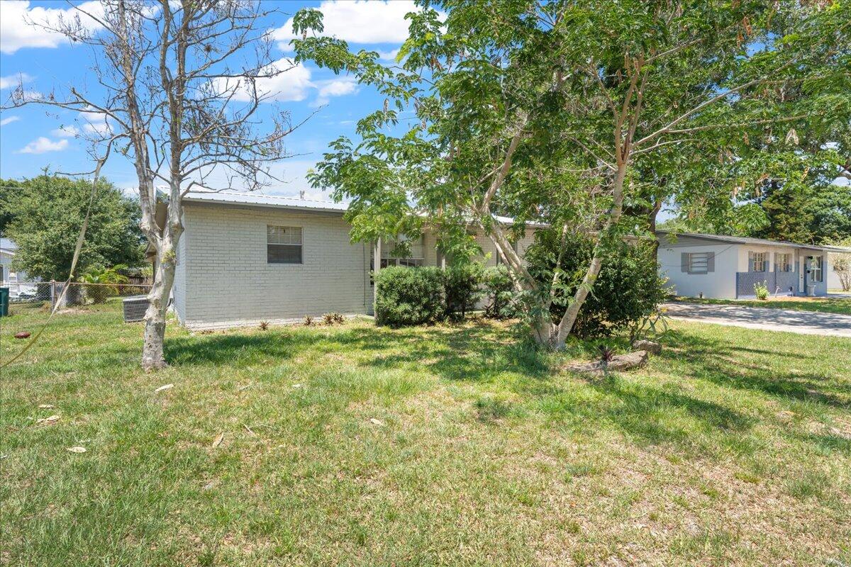 3308 Purdue Street Melbourne, FL 32901 - Photo 42 of 43 a view of backyard of house with green space