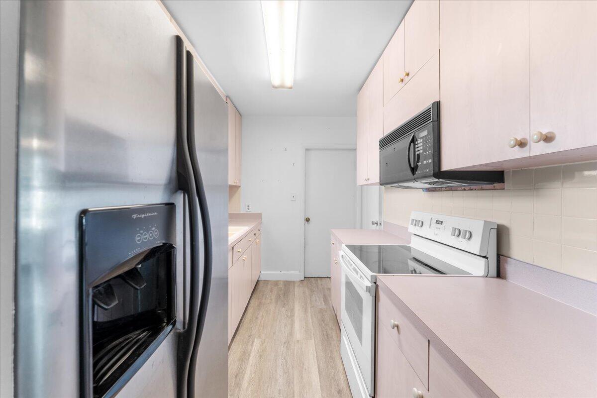 3308 Purdue Street Melbourne, FL 32901 - Photo 8 of 43 a view of a kitchen with electric appliances