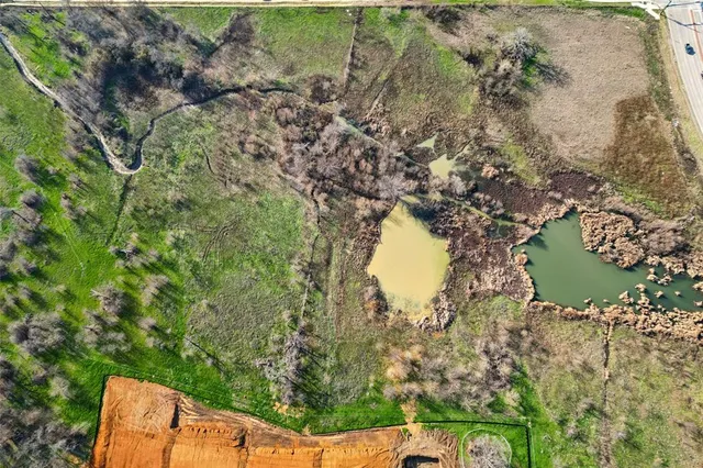 a aerial view of a house with a yard