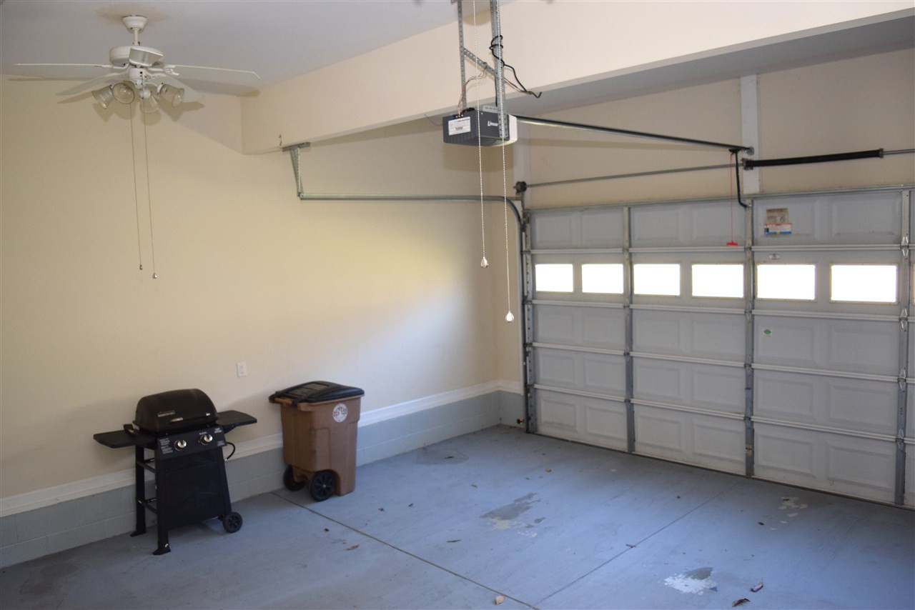 620 Middle Bridge Road Wake Forest, NC 27587 - Photo 22 of 25 Finished Garage has closet for yard tools and ceiling fans to keep you cool if you wanted to have a workshop area. 2 car garage