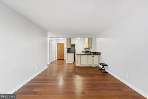 a view of kitchen and wooden floor